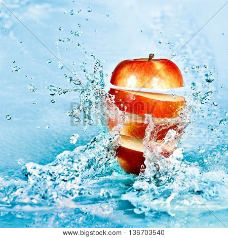 image of fresh water splash on red apple