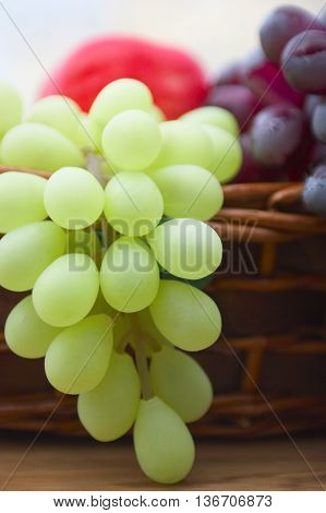 Red And White Grape Branch In A Basket
