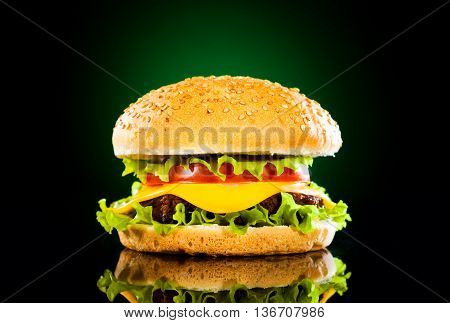 Tasty Hamburger And French Fries On A Dark