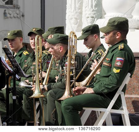 MOSCOW. RUSSIA - May 28, 2016: Trumpeters in anticipation for his musical part. Horn player before the performance. Brass band playing on the Central Avenue in the Park of VDNH. International Military Music Festival 