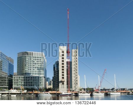 Boston Massachusetts USA - June 30 2016: Crane rises over 50 Liberty construction project on South Boston waterfront