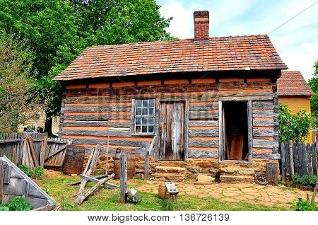 Old Salem North Carolina - April 21 2016: Fachwerk half-timber cabin behind the 1771 Miksch House *