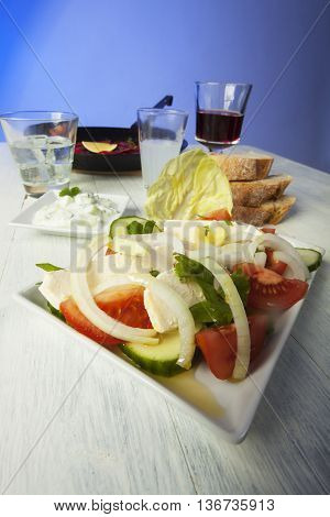 greek salad with florini peppers on wood