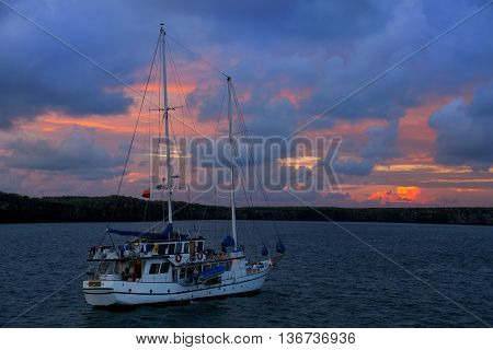 Sailboat at sunrise in Great Darwin Bay Genovesa Island Galapagos National Park Ecuador