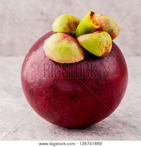 Delicious Mangosteen Fruit Arranged On Stone Background.mangosteen The Queen Of Thai Fruits.