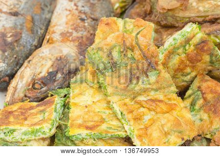 Thai Cuisine cha-om omelet with Fish fry Close-up
