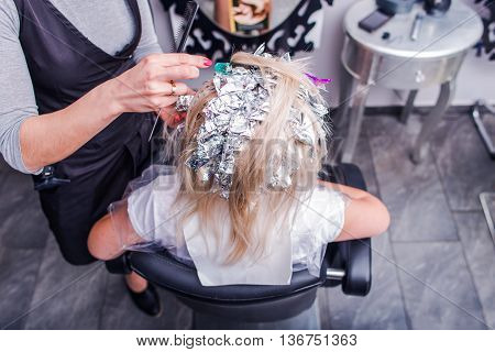 Woman in Hair Salon Making Balayage. In the Beauty Salon. Head Top View.