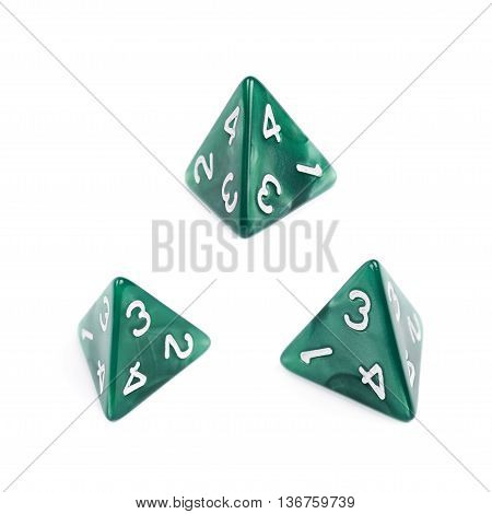 Green roleplaying polyhedral tetrahedron gaming plastic dice isolated over the white background, set of three different foreshortenings