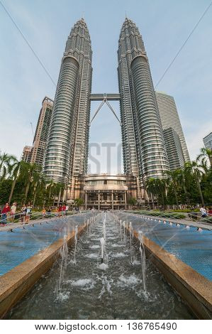 Kuala-Lumpur Malaysia - June 23 2016: View to Petronas Tower and foutain