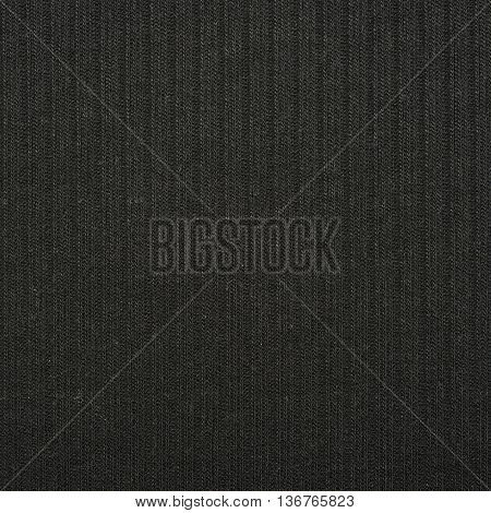 Fragment of a gray cloth fabric material texture as an abstract background composition