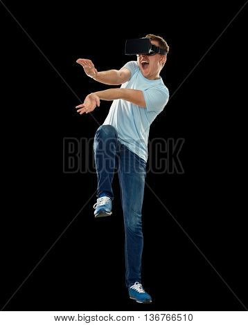 3d technology, virtual reality, entertainment, cyberspace and people concept - happy young man with virtual reality headset or 3d glasses playing game and catching something