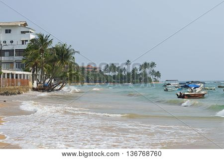 HIKKADUWA, SRI LANKA - MARCH 22, 2015: Evening surf at Hikkaduwa beach. The famous big beach in Sri Lanka