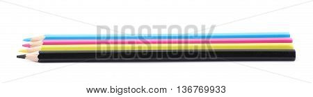 Four cmyk colored drawing pencils composition isolated over the white background