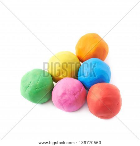Multiple colorful plasticine balls, composition isolated over the white background