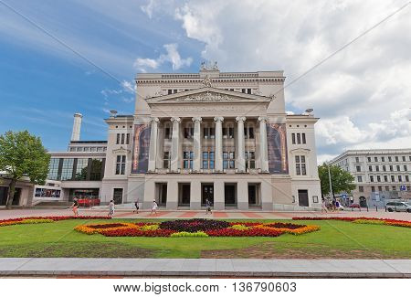 RIGA LATVIA - JUNE 29 2016: Latvian National Opera (circa 1863) on the Aspazijas (former Theater) Boulevard in the historic center of Riga Latvia. Architect Ludwig Bohnstedt