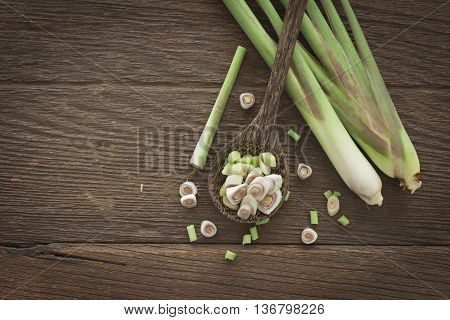 Top view Fresh sliced lemon grass on wood spoon.