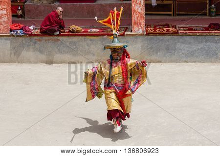 LAMAYURU INDIA - JUNE 13 2015: Unidentified buddhist lamas dressed in mystical mask dancing Tsam mystery dance in time of Yuru Kabgyat Buddhist festival at Lamayuru Gompa Ladakh North India