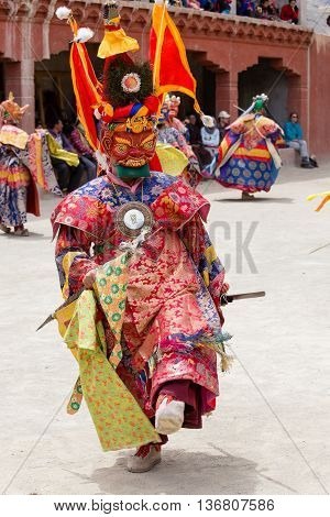 LAMAYURU INDIA - JUNE 13 2015: Unidentified buddhist lamas dressed in mystical mask dancing Tsam mystery dance in time of Yuru Kabgyat Buddhist festival at Lamayuru Gompa Ladakh North India