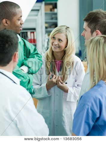 Group of young doctors talking in hopital
