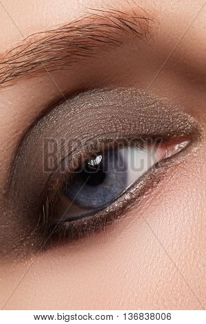 Close-up Of Woman Eye With Beautiful Brown Smokey Eyes Make-up