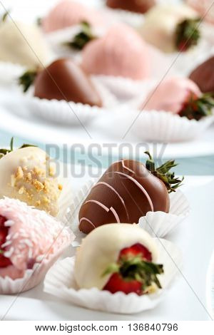 Strawberries Covered In Chocolate On A White Pergament