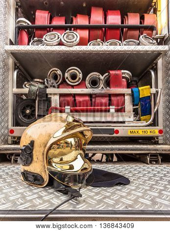Modern Golden Fire Brigade Helmet With Hoses