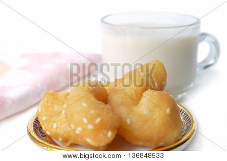 Chinese cruller and soy milk on white background