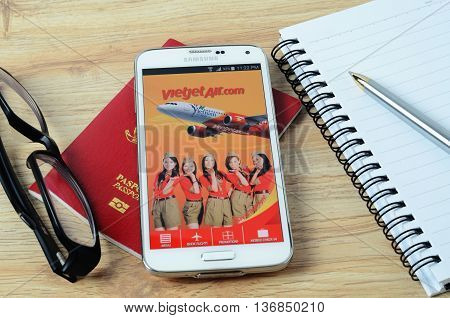 KOTA KINABALU, MALAYSIA - JULY 1, 2016: Vietjet Air on mobile app, the app helps managing travel plans, make bookings, check-in and choose seat anytime, anywhere.