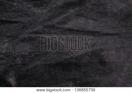 Black Leather for Concept and Idea Style of Fine Leather Crafting Handcrafts Workspace Handmade or Handcrafted Leather Worker. Background Textured and Wallpaper. Vintage Rustic. Close up Full frame.