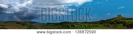 Dorset countryside around Colmer's Hill under blue skies with a rainbow