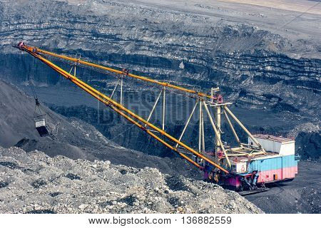 Dragline on open pit coal mine in Russia