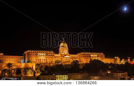 Buda Castle Moon Budapest Hungary. Buda Castle was first built in 1242 and enlarged by Empress Maria Theresa in the 1700s.