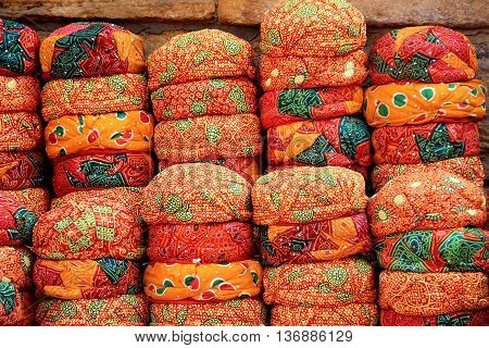 Display of neatly piled up red Rajasthani Caps near Patawon-ki-Haweli in Jaisalmer Rajasthan India Asia
