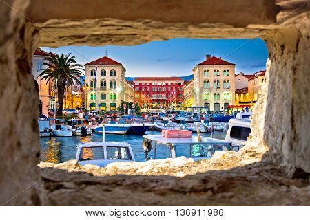 Prokurative square in Split evening view through stone window Dalmatia Croatia