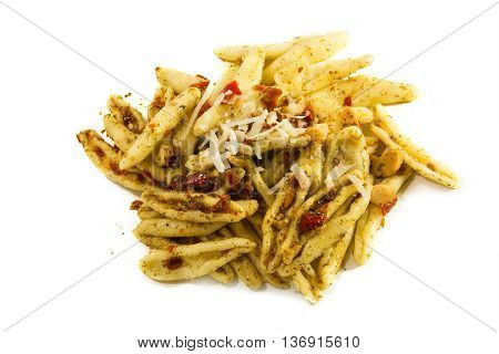 homemade pasta variety called capunti specialty from southern Italy with garlic and oil pickled tomatoes and cheese parmesan view from above isolated with shadow on a white background selective focus