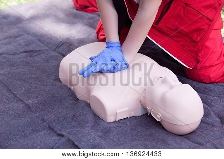CPR dummy first aid training. Cardiopulmonary resuscitation - CPR. Cardiac massage.
