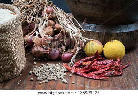 spices many with mortar made of wood on dark wooden table