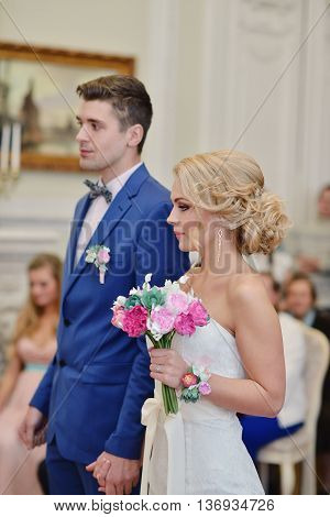 Beauty Bride And Handsome Groom Are Registering The Marriage. Wedding Couple Is Marrying. Beautiful