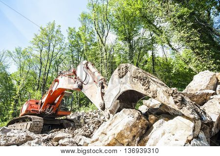 Excavator with big shovel to work with rocks