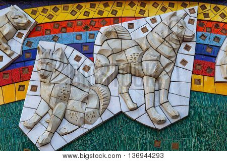 TOKYO JAPAN - NOVEMBER 28 2015: Hachiko low relief sculpture at Shibuya station the dog is remarkable loyalty to his owner which continued for ten years waiting for his owner at thw station after his owner's death
