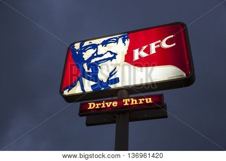 DALLAS Tx USA - APR 17 2016: Logo of a Kentucky Fried Chicken (KFC) fast food restaurant illuminated at night. Dallas Texas United States