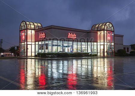 DALLAS Tx USA - APR 17 2016: Arby's restaurant building illuminated at night. Arby's is the second largest sandwich chain in the U.S. with more than 3400 restaurants