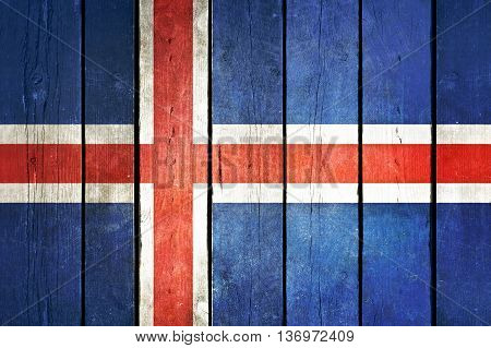 Iceland wooden grunge flag. Iceland flag painted on the old wooden planks. Vintage retro picture from my collection of flags.