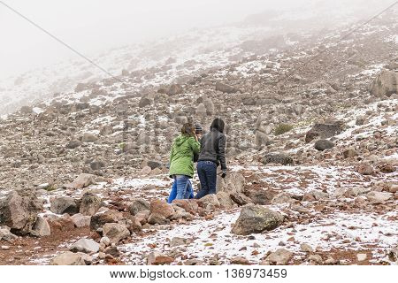 CHIMBORAZO, ECUADOR, OCTOBER - 2015 - Young couple climbing climbing the chimborazo mountain in Ecuador South America