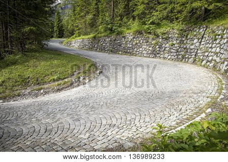 Winding mountain pavement road - a turn