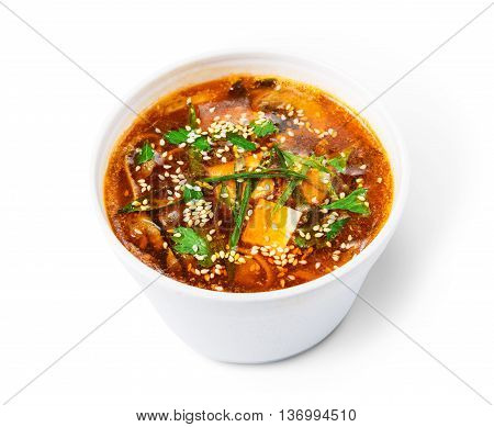 Japanese cuisine food delivery - miso soup isolated closeup in white plastic plate