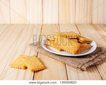 Stacked Butter Biscuits with sesame on wooden background