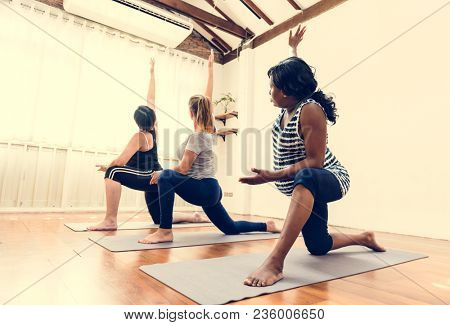 Pregnant woman in yoga class