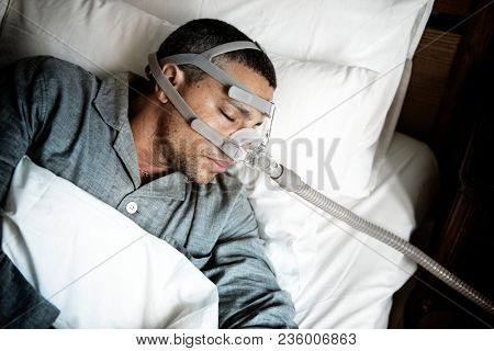 Sick man wearing an oxygen mask