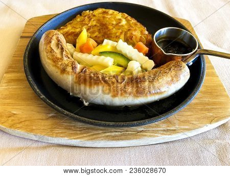 Wurstel With Rosti, A Typical Dish From The Engadin Region In Saint Moritz
